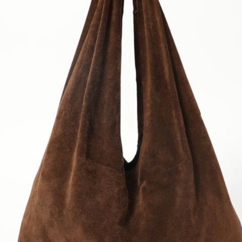 The Row bindle knot suede bag.