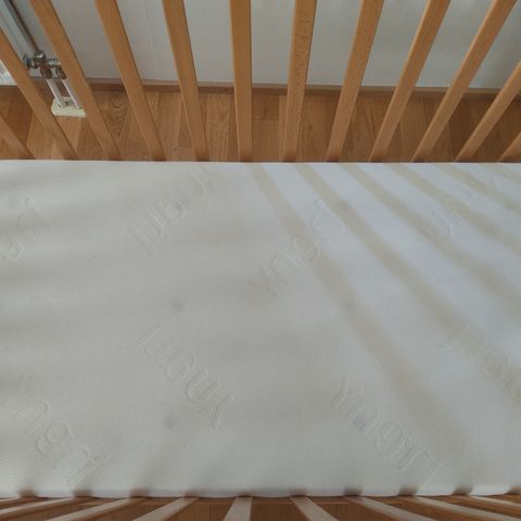 Baby cot bed with new mattress