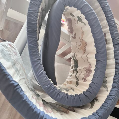 Cotton baby bed bumper.