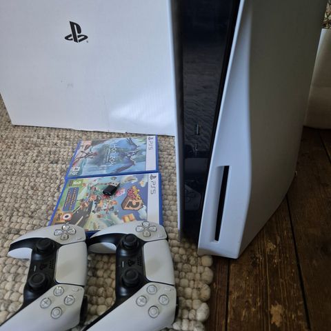 PlayStation 5 disc edition with 2 controllers and games