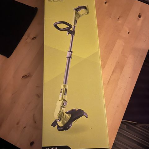 Ryobi gresstrimmer med lader og batteri