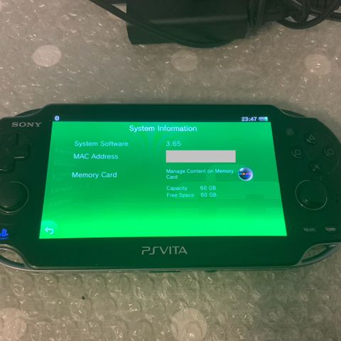 PS Vita OLED konsoll + Lader + Spill case + PS Vita Minnekort 64GB