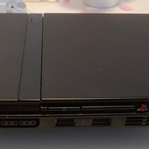 Komplett og svært lite brukt Playstation 2 slim