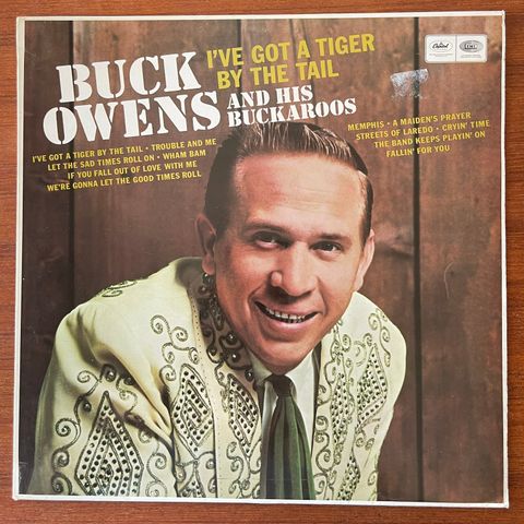 Buck Owens And His Buckaroos - I've Got A Tiger By The Tail