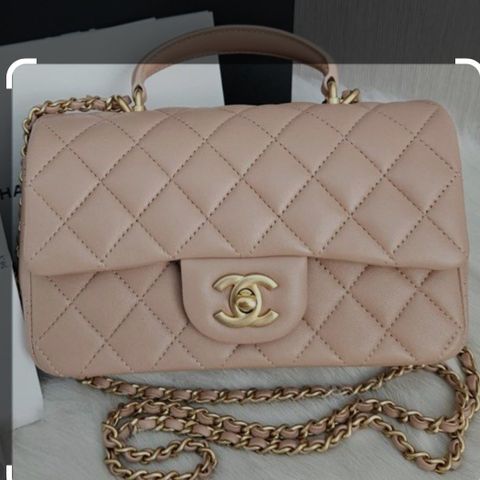 Chanel flap bag med top handle