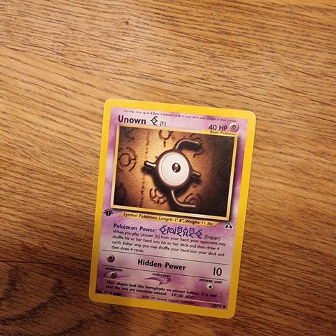 Unown [E]. 67/75. 1st Edition. Neo Discovery. Pokémon-kort