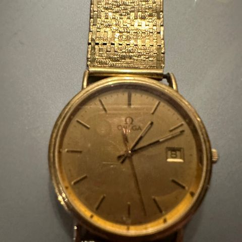 Omega gull klokke med gull lenke. 18 k.