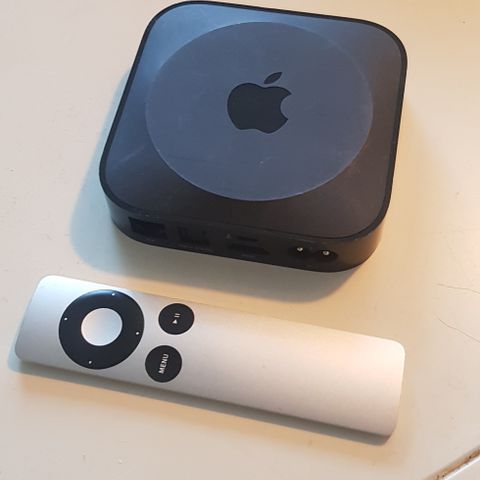 Selger en eldre Apple tv med fjernkontroll!