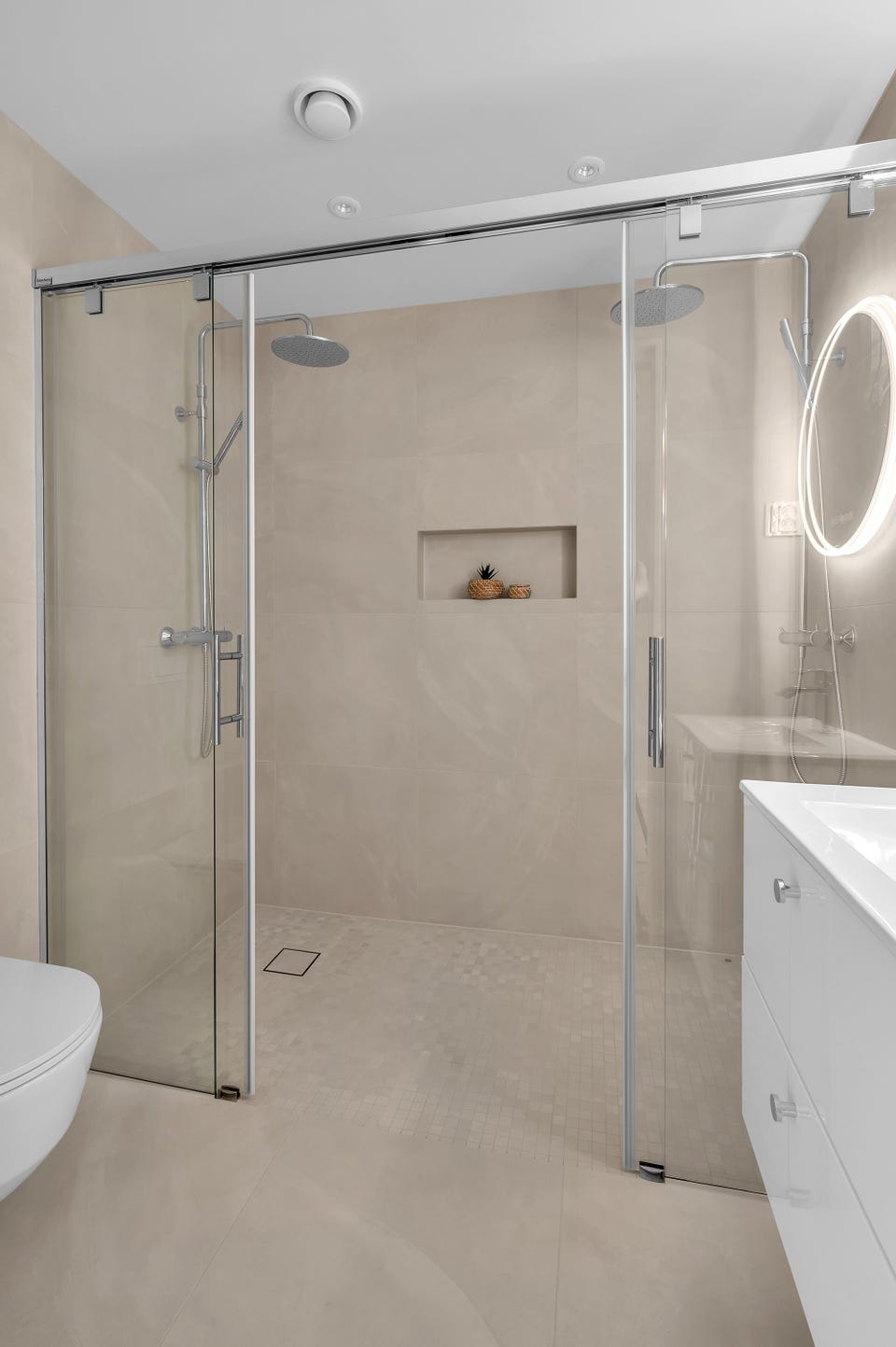 The bathroom has a large double shower.