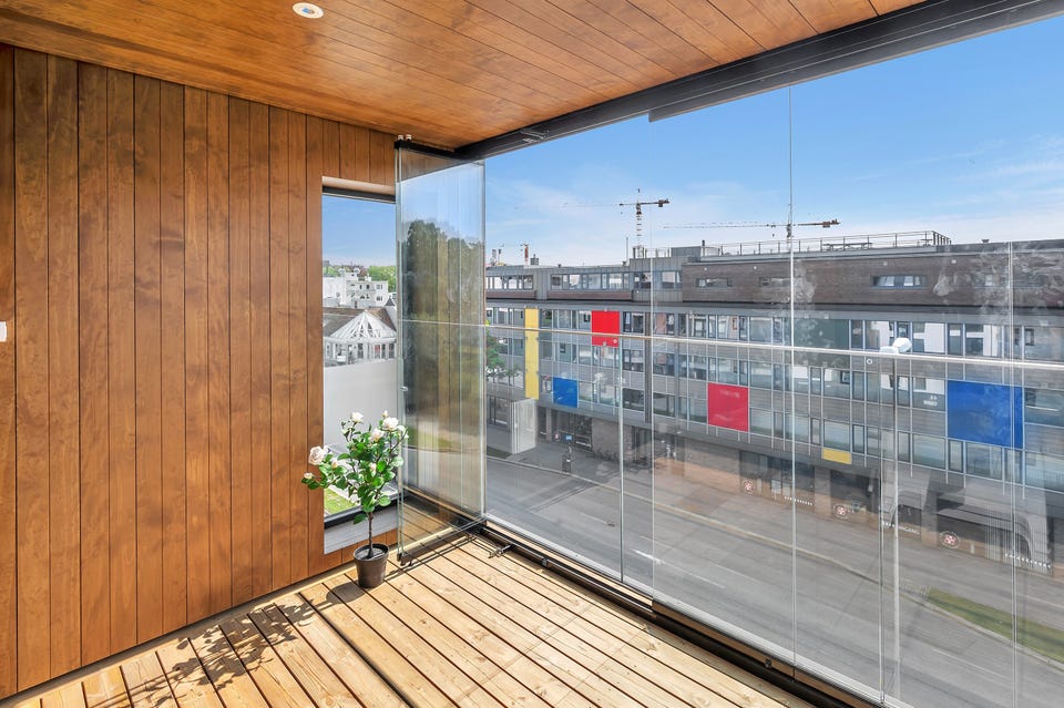 The balcony has glass sliding doors, so you can easily use it all year round.