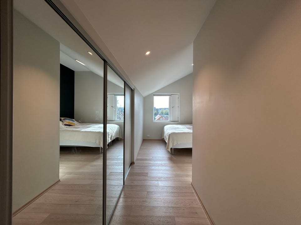 Large sliding-door wardrobe on the way into the bedroom