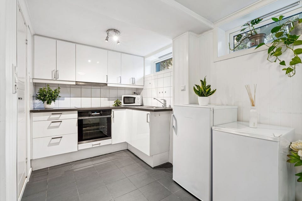 Bright kitchen with good cupboard and worktop space.