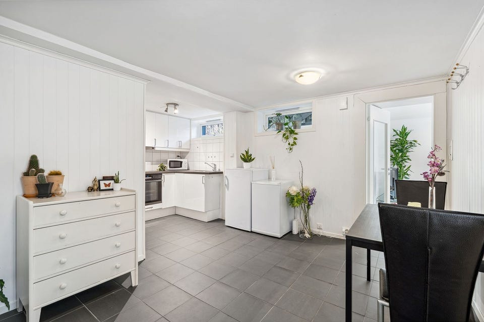 Kitchen and dining area in an open, practical layout.