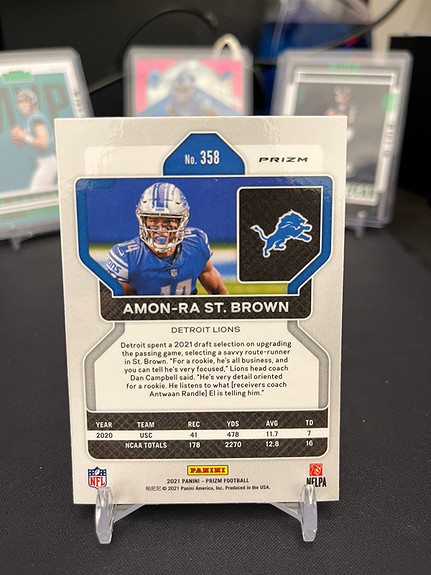 Amon-Ra St. Brown 2021 Panini Prizm Orange Laser Prizm Rookie Card