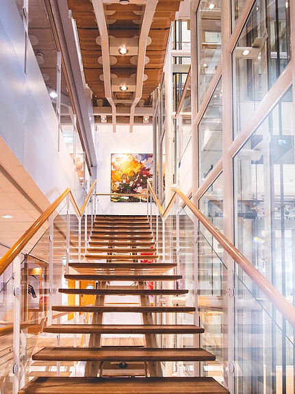 The stairs are a gallery in itself, showcasing the Grieg art collection