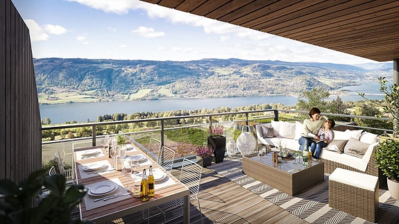 Leiligheten vil få en stor og privat terrasse godt adskilt fra naboens innsyn. Her kan man nyte sola hele dagen og den flotte mjøsutsikten. Bildet er en illustrasjon og kan avvike fra standard leveranse.