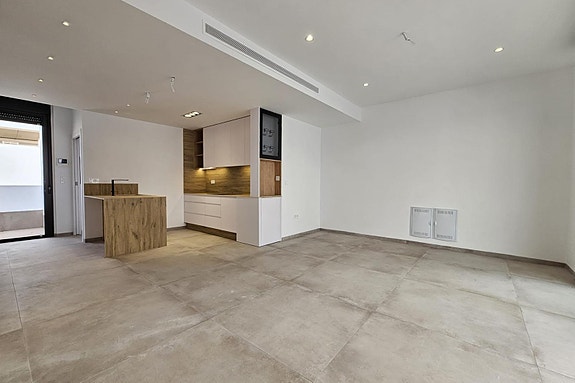 Stue med åpen kjøkkenløsning