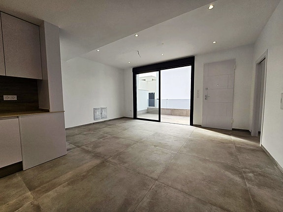 Stue med åpen kjøkkenløsning