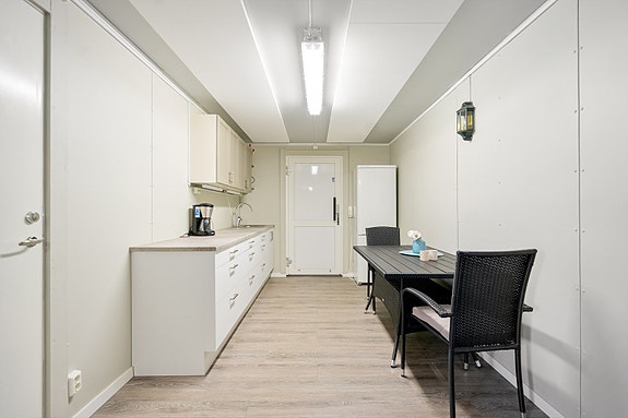 Fellesareal med møterom og kjøkken i samme etasje som leiligheten