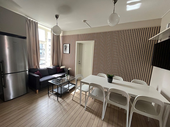 Hyggelig fellesrom inn mot bakgården