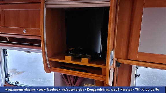  Tv kan skjules i skap