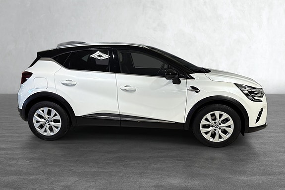 Sleek sideprofil med svarte detaljer gir et sporty uttrykk.
