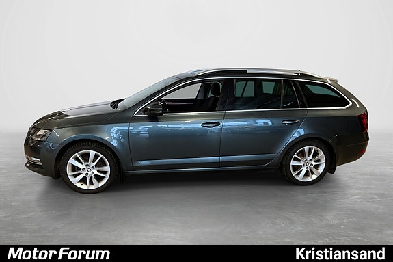 Sporty sideprofil med tonede ruter og lettmetallfelger.